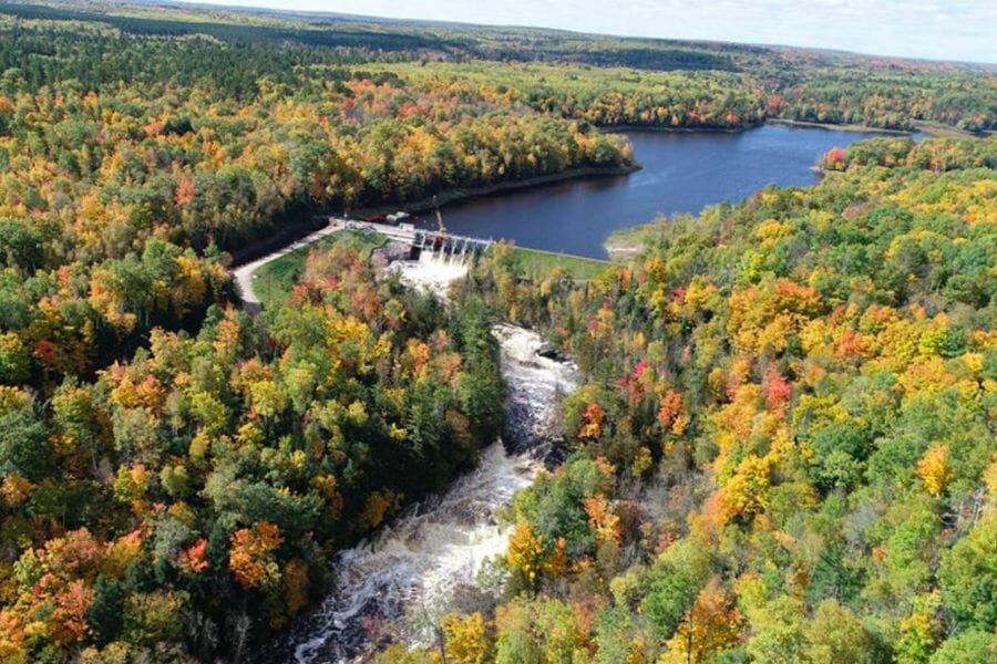 A scenic aerial view of the water ways and surrounding lush trees at Pine River Flowage