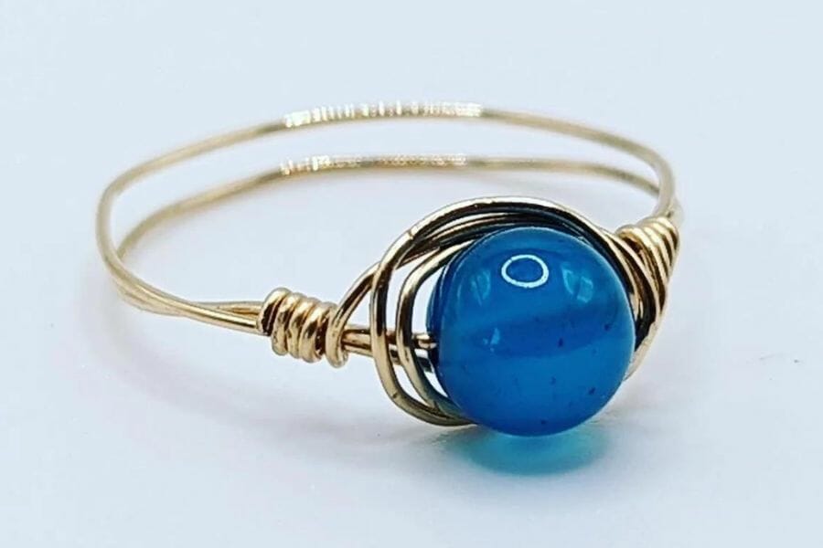 Blue jade ball set in a gold ring