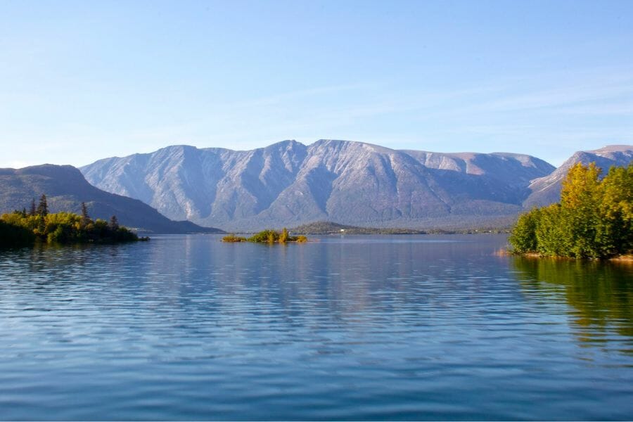 A photo of Lake Iliamna showing its serene waters and surrounding mountains