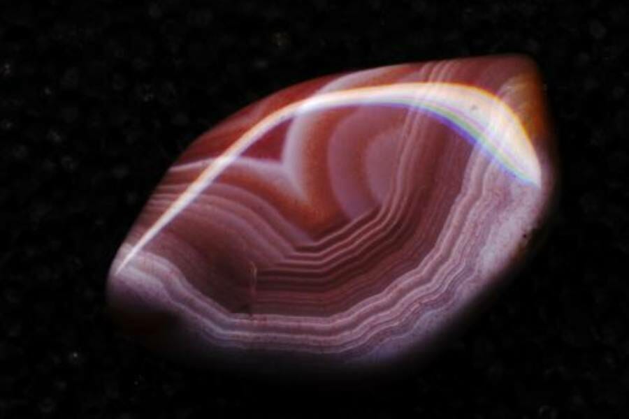 A chunk of purple-pink striped agate