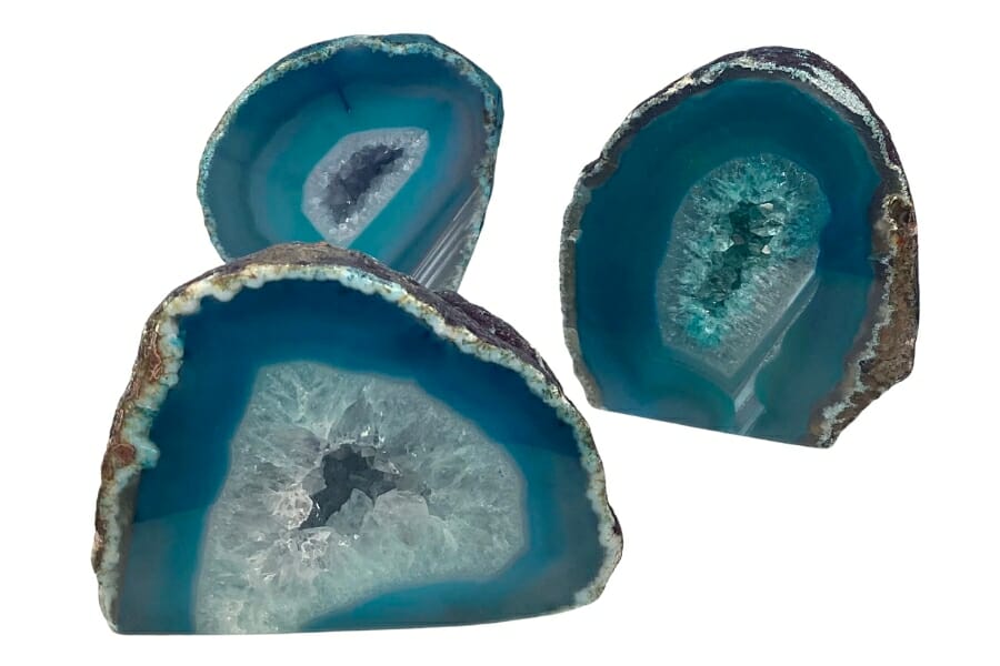 Three halves of Agate geode in teal color