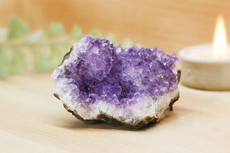 A stunning amethyst geode with purple and white crystals