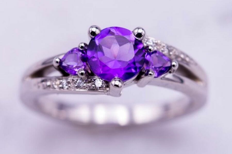 A beautiful silver engagement ring with a sparkling purple Amethyst gemstone