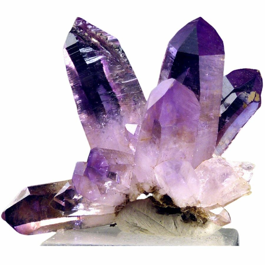 Several large purple amethyst crystals in a cluster