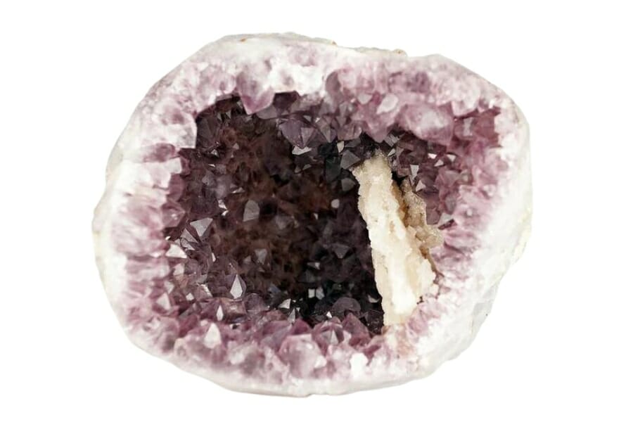 An open Amethyst geode showing sparkling purple crystals