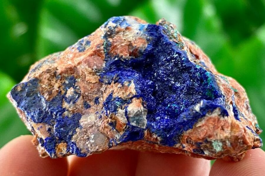 A gorgeous azurite crystal with blue hues and brown spots