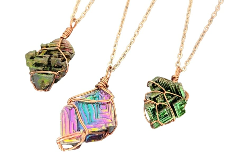 Three Bismuth pendants on gold necklaces