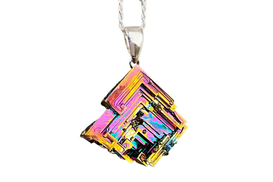 A piece of colorful Bismuth crystal used as pendant on a silver necklace