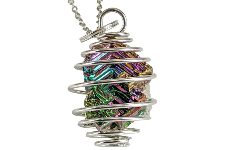 A pretty pendant with silver circling a piece of Bismuth