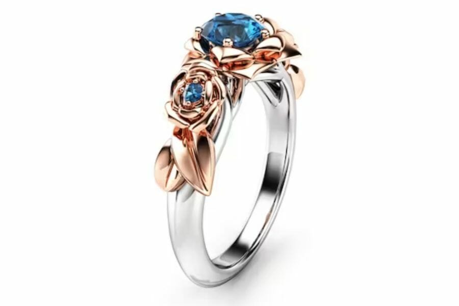 Blue diamond ring with rose gold details