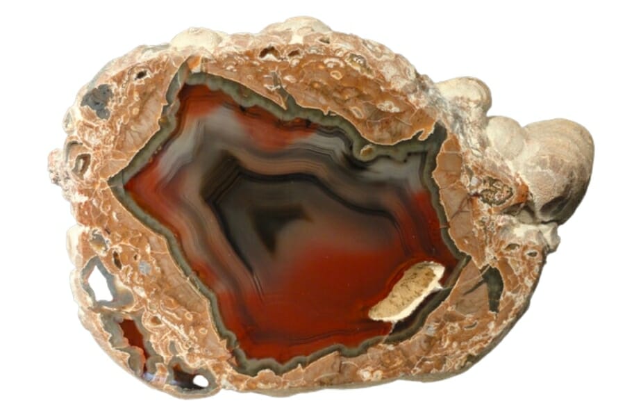 A beautiful specimen of Banded Agate with reddish hues over a black and gray pattern