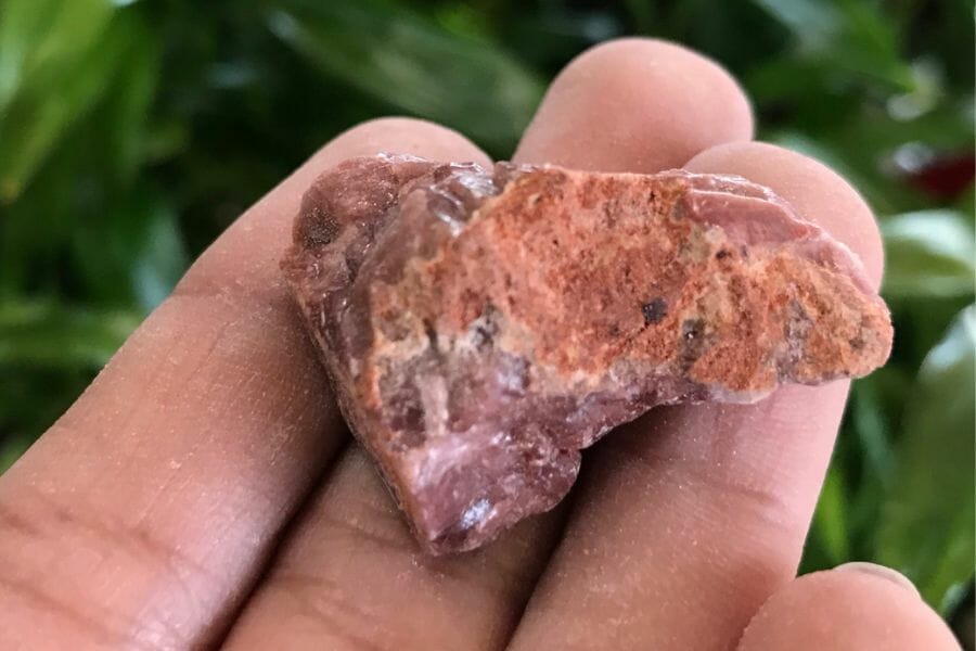 A distinct red calcite with different surfaces in its area