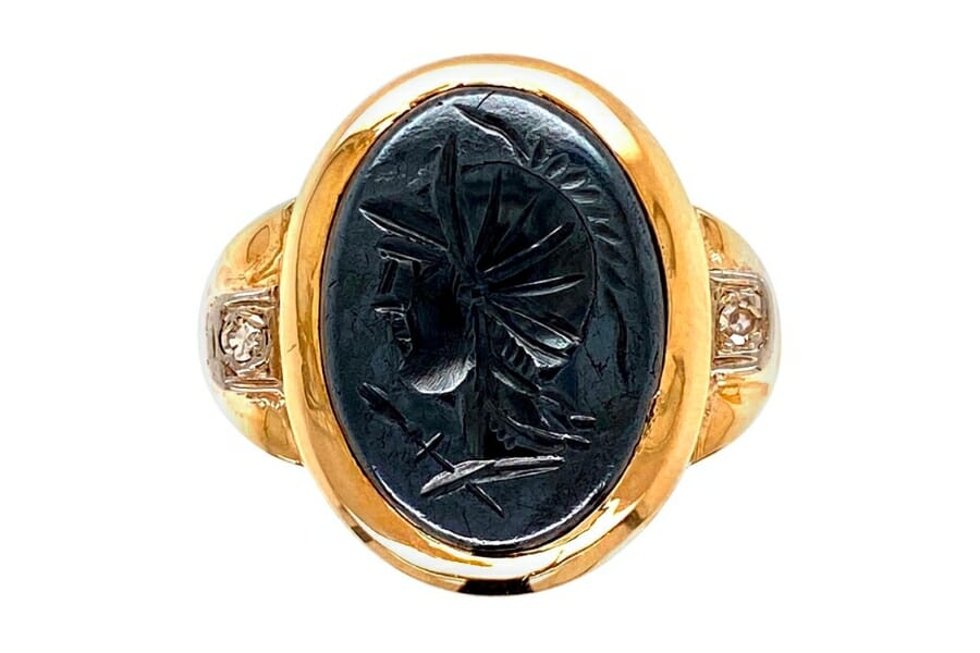 A victorian gold ring with portrait-carved Hematite as center stone