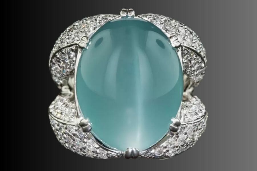A stunning Cat's Eye Aquamarine cabochon set as center stone of a platinum ring