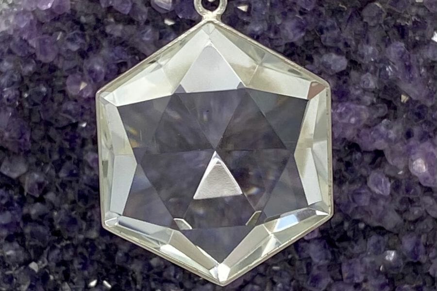 A hexagon shaped clear quartz pendant necklace