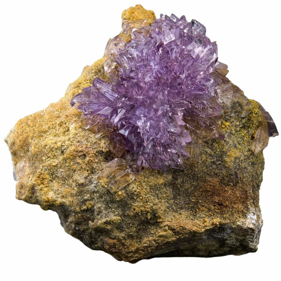 Large purple Creedite crystal on a rock cluster