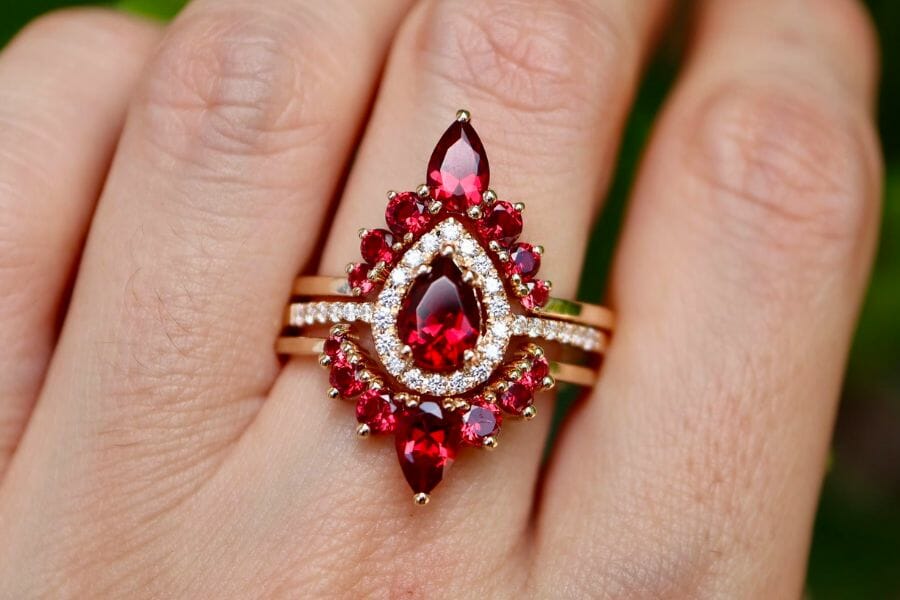 A stunning accent ring embedded with different shapes of red Garnets