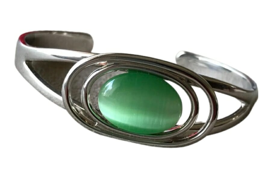 A silver bracelet with an oval-shaped Green Moonstone as center stone