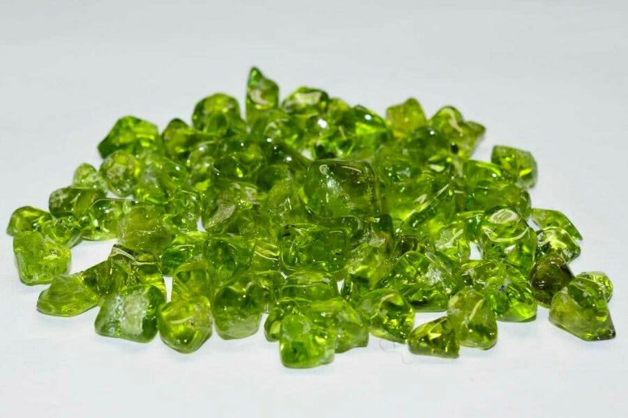 A bunch of polished, shiny green Peridot crystals