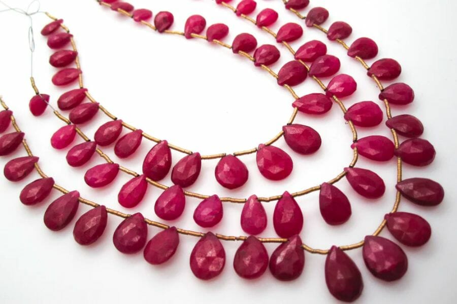 A three-layered necklace filled with pear-shaped heat treated Rubies