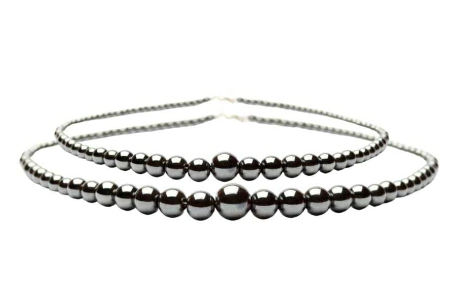 Two necklaces each adorned with black, lustrous Hematite beads