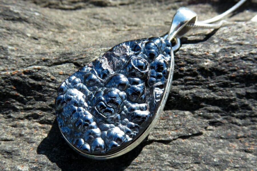 A silver pendant with Kidney Ore Hematite