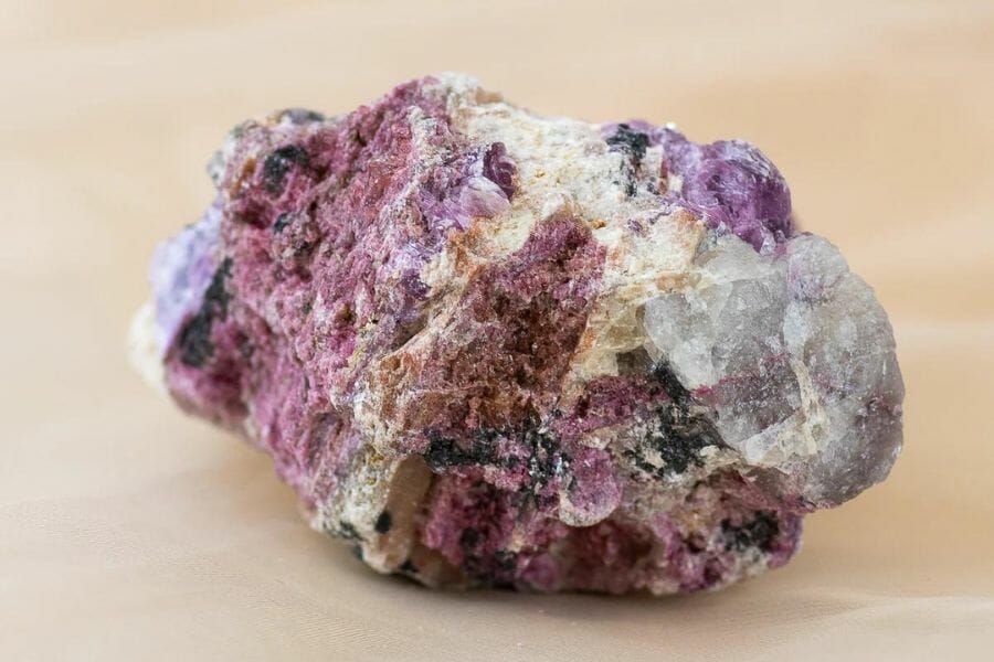A stunning pink lepidolite with black and white spots