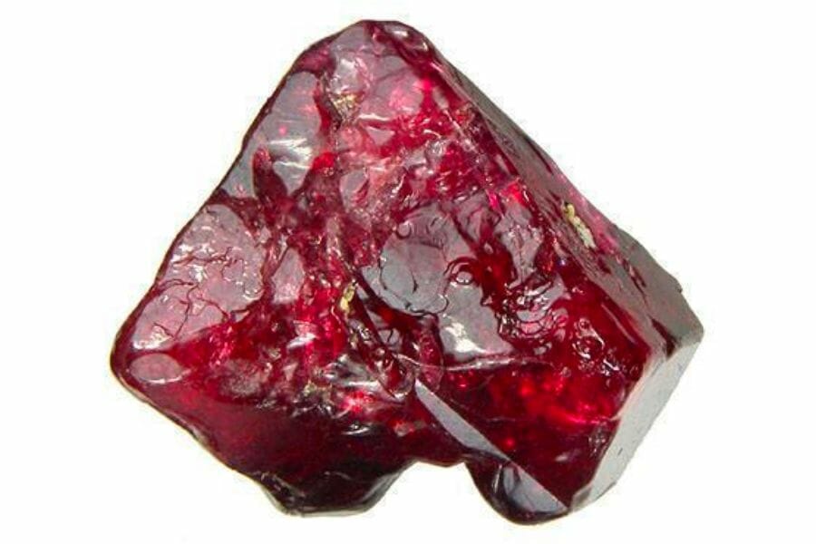 A beautiful piece of sparkly red Ruby crystal on white background