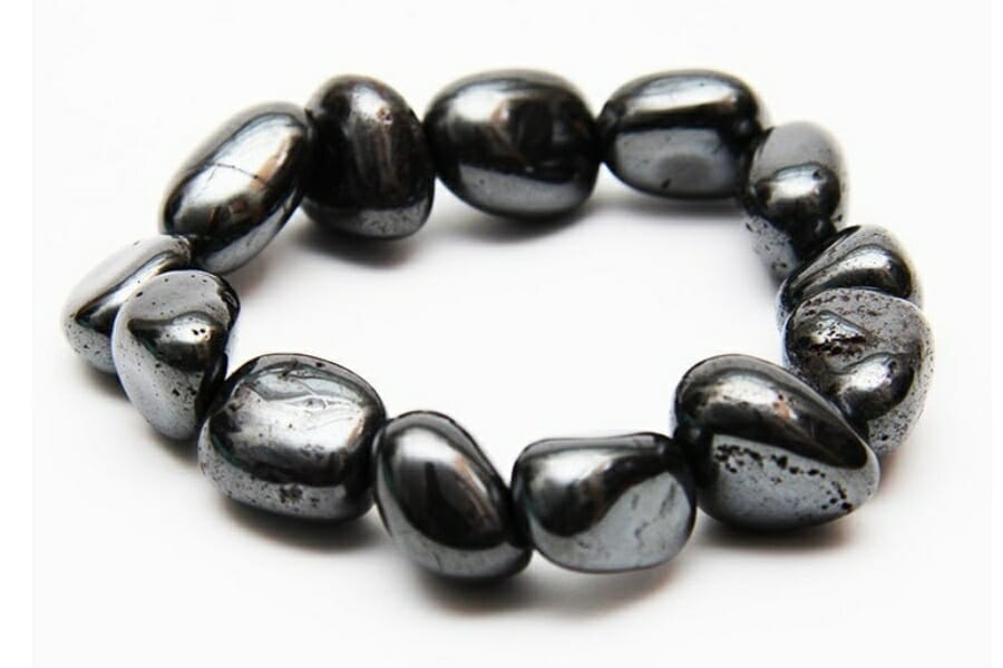 A bracelet made out of black, shiny Martite specimens