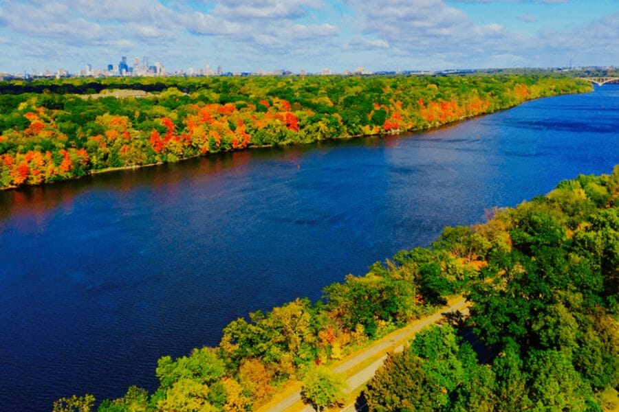Beautiful stretch of the Mississippi River surrounded by lush and vibrant trees
