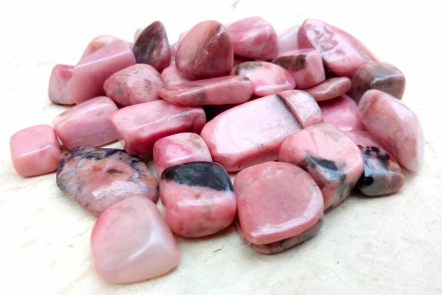 A bunch of polished pink Rhodonite crystals with black details