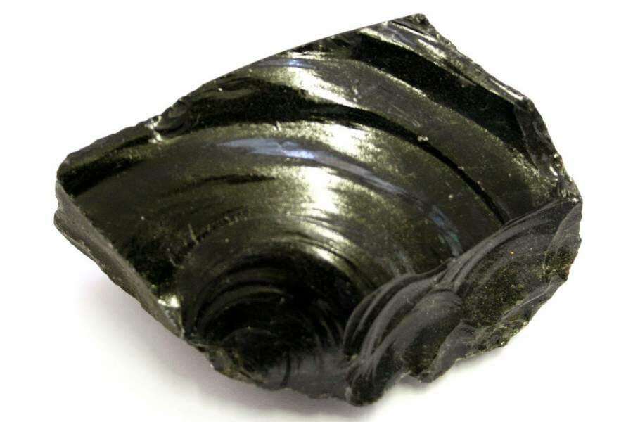 A striated chunk of black and gold obsidian 