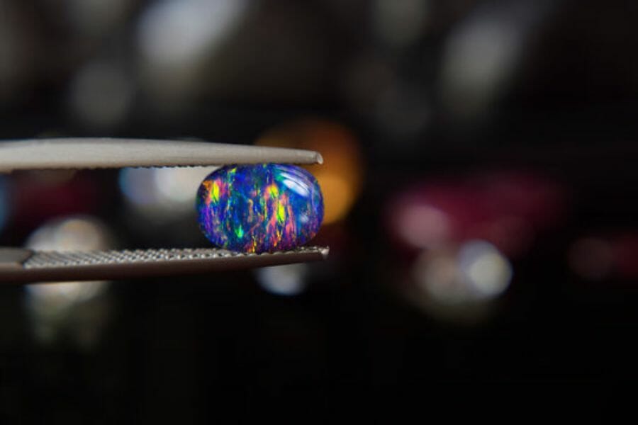 A photo of a unique opal getting appraised