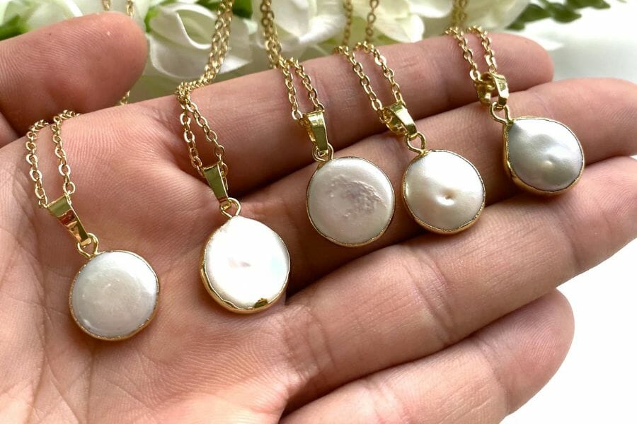 Four elegant raw pearl necklaces