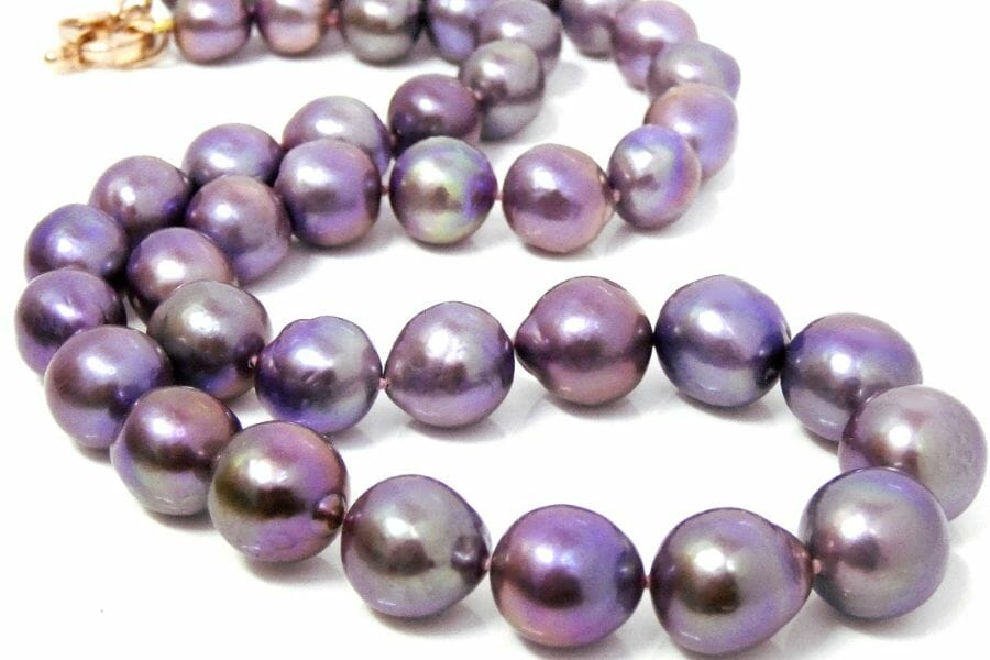 A dazzling necklace made with purple pearls