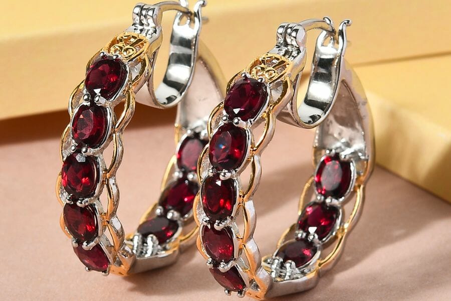 A pair of earrings studded with deep red Pyrope Garnets