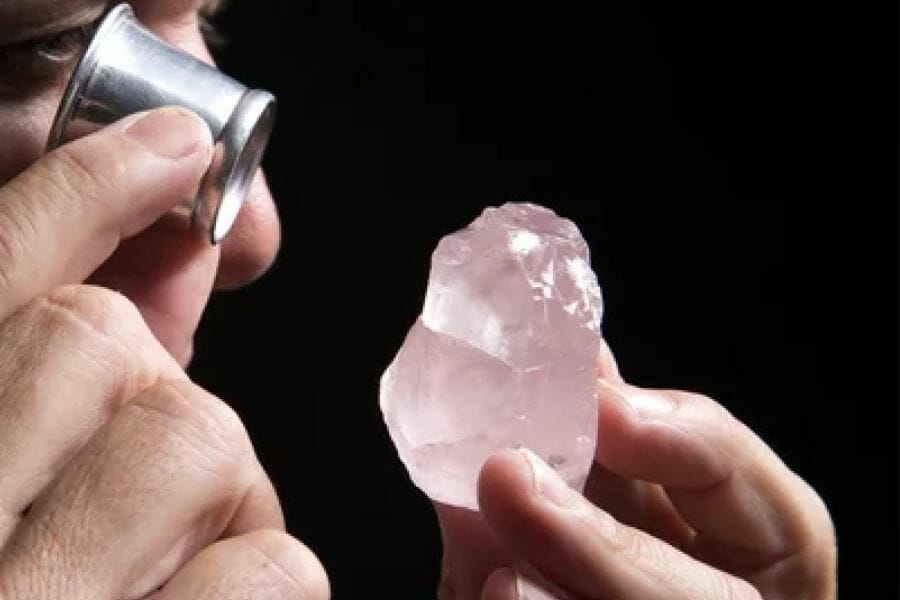 A man doing an appraisal on a quartz crystal