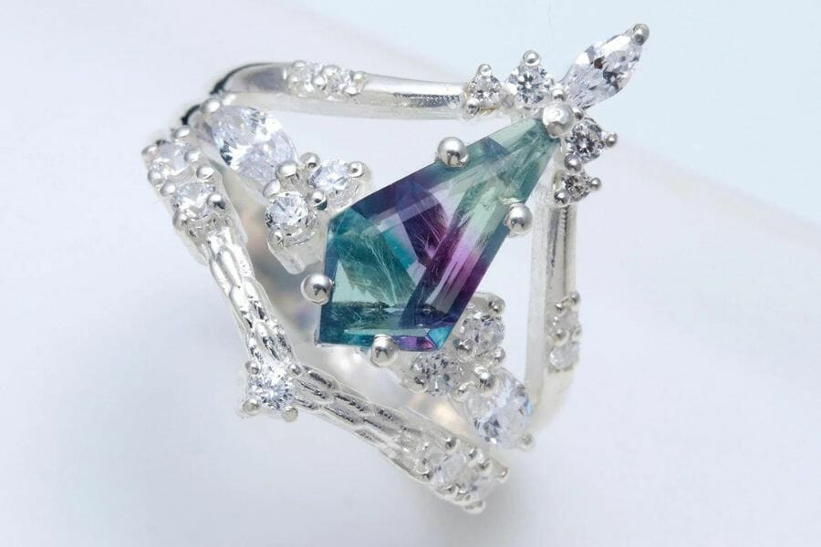 A stunning rainbow fluorite ring with intrinsic details