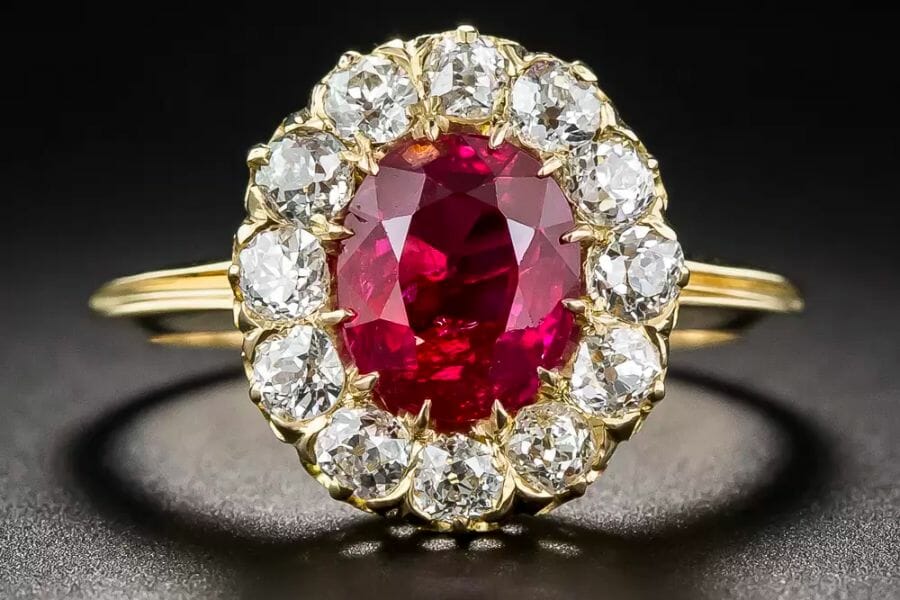 A beautiful Burma Ruby set on a gold ring and surrounded by sparkling diamonds
