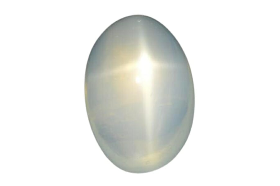 A piece of white Star Moonstone cabochon