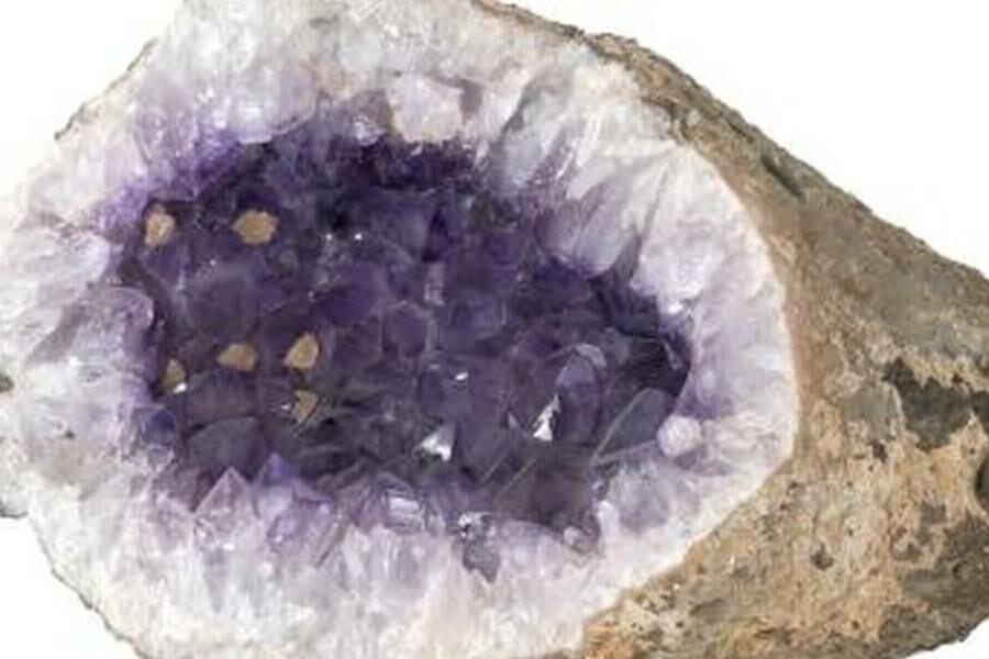 a grey pebble-looking rock that is a white and purple crystal-filled thunder egg