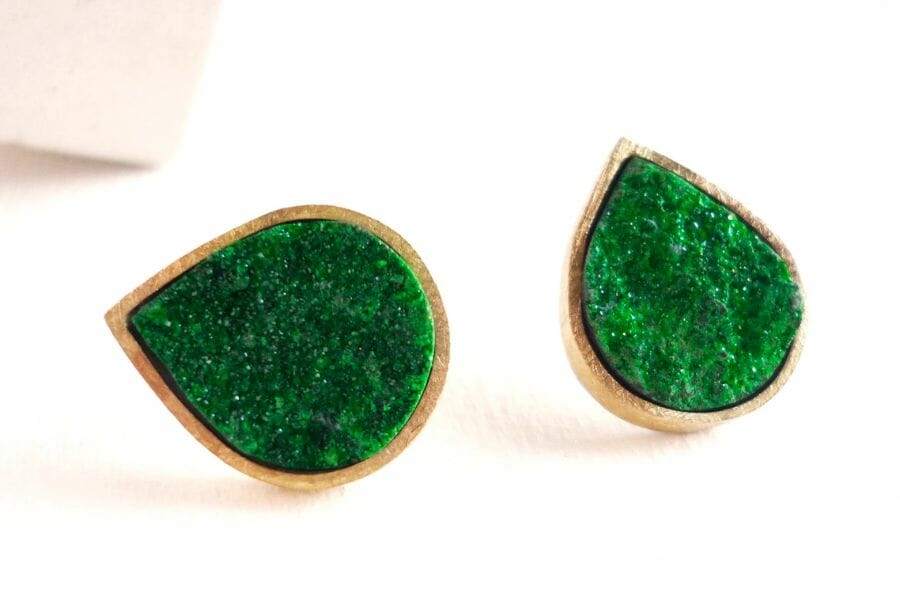 A pair of earrings with green textured Uvarovite Garnets