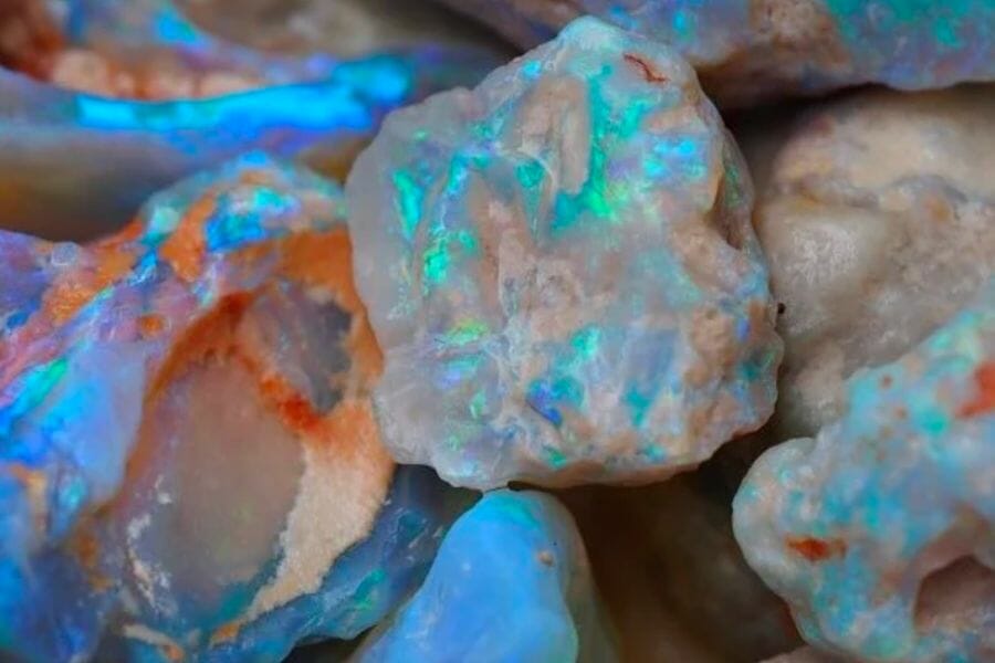 A bunch of white Opal crystals with a metallic rainbow luster