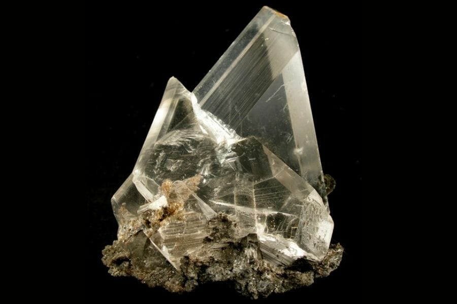 A beautiful sample of a transparent Selenite crystal attached to a rock