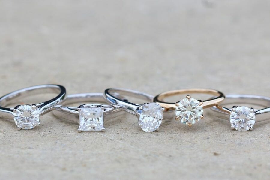 Five beautiful engagement rings all encrusted with White Sapphires