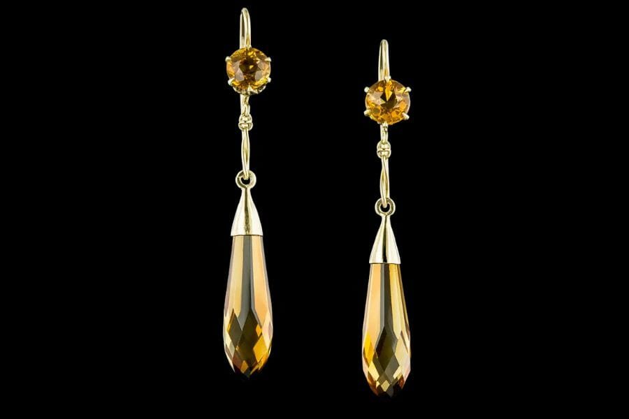 A pair of elegant drop earrings with teardrop-shaped Yellow Citrines