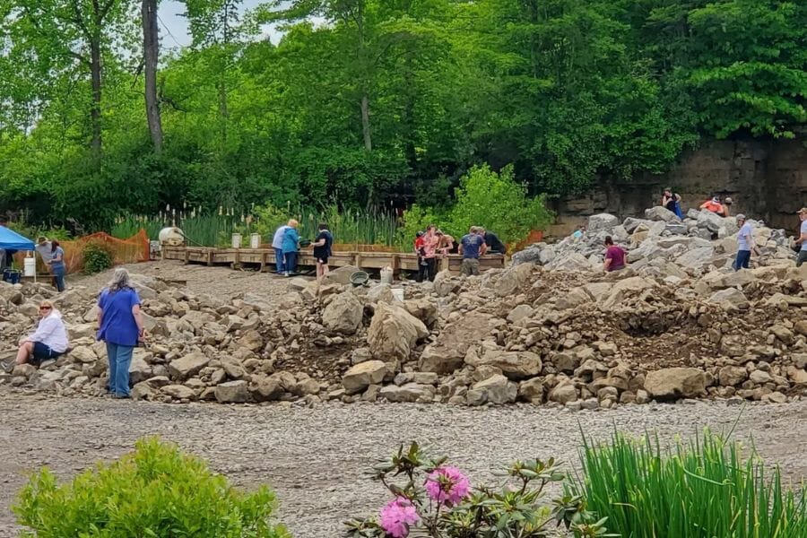 A group of kids and adults rockhounding at the Ace of Diamond Mine and Campground