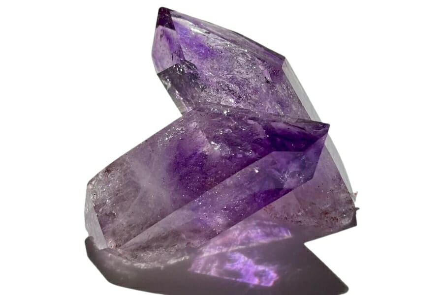 Purple Amethyst crystals on white background