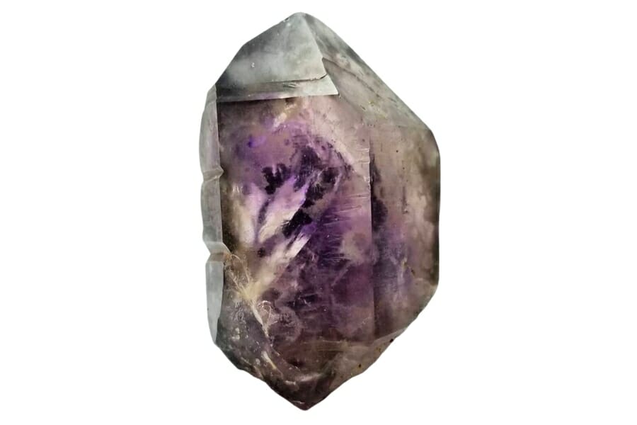 A big Amethyst crystal with purple hue in the middle and Hematite inclusions on the side