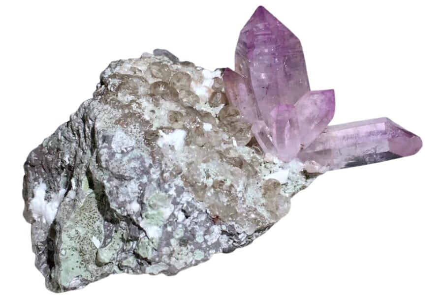 Cluster of lilac-colored Amethyst crystals protruding from a rock